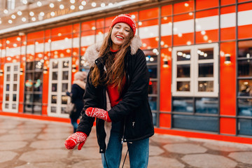 Wall Mural - woman having fun in Christmas street