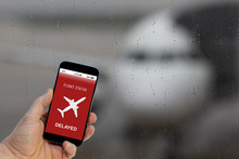 Flight Delayed Notification On Smartphone Application Announces Bad News To Tourist