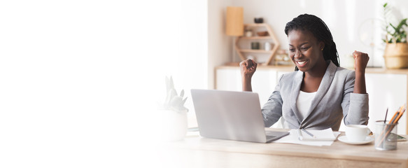 Excited African American Businesswoman Celebrating Success At Workplace
