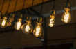 © Olga - light bulbs against a dark wall