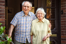 Elderly Couple At The Front Door