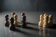 Treason, betrayal and whistleblowing concept. Two divided groups of pawns on a gray background.