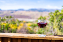 Red Wine Glass On Terrace Railing And Bokeh Background View Of Autumn Foliage Yellow Trees In Aspen, Colorado Rocky Mountains