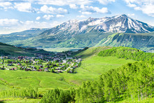 Crested Butte, Colorado Town Cityscape High Angle View From Snodgrass Hiking Trail In Summer With Alpine Meadows And Aspent Trees Forest Grove