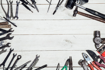 construction hammers screwdriver repair tool pliers on the board