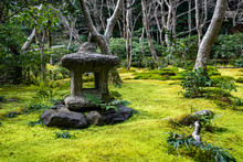 Traditional Japanese Stone Lantern In A Moss Garden