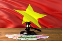 Vietnam Bribing Concept. Law Theme, Mallet Of The Judge On Wooden Desk With National Flag Background.