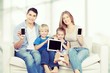 © BillionPhotos.com - Beautiful smiling Lovely family siting on sofa