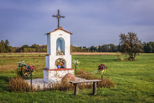 Roman Catholic Roadside Chapel Near Brochow Village On The Edge Of Kampinos Forest In Mazowieckie Region