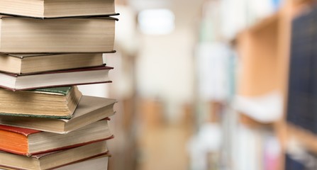 Sticker - Old Books stacked on background.