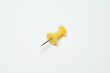 © chalongrat - Close up of Yellow pin  on white background