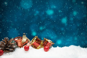 Beautiful christmas decoration on snow with blue bokeh background