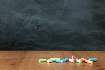 Wall Mural - Education image – empty table and blackboard