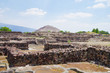 Popular tourist destination ancient Aztec city ruins of the pyramids of Teotihuacan close to Mexico City with the Pyramid of the Sun and the Pyramid of the Moon and prehistoric stone walls