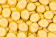 © Nikolay - Fresh banana slices background. Top view.