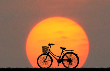 Poster - silhouette vintage bike on sunrise