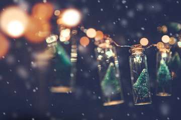 Wall Mural - close-up, elegant christmas tree in glass jar with snowflakes background, copy space, christmas conc