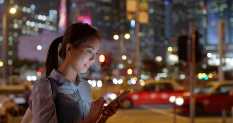 Canvas Print - Woman use mobile phone app for call taxi at night