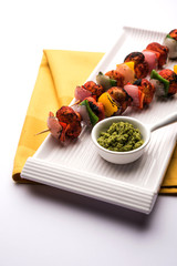 Wall Mural - Barbecue or tandoori Mushroom Tikka, served in a plate with green chutney and ketchup. selective focus