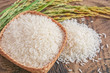 Jasmine rice in a wooden bowl with background.