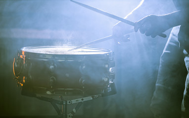 Wall Mural - man playing the snare drum on a beautiful colored background