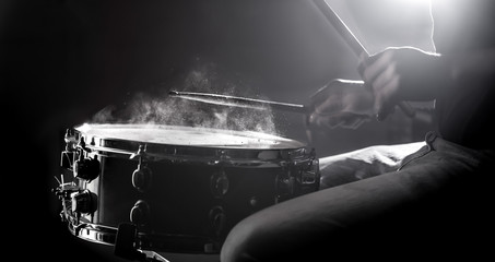 Wall Mural - man playing the snare drum on a beautiful colored background