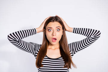 Sticker - Portrait of disappointed hipster touching her head with hands looking wearing striped shirt isolated over white background