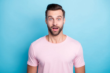 Poster - Closeup photo of amazing guy with open mouth not believe eyes astonished unexpected good news wear casual pink t-shirt isolated blue color background