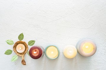 Burning candles on white background with copy space on the top.