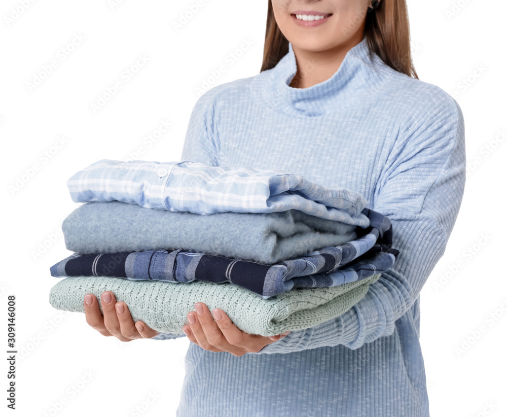 Young woman with clean clothes on white background, closeup