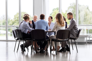 Wall Mural - business, people and corporate concept - business team meeting at office