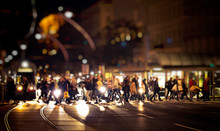 Pedestrians Crossing Night Street In The City 