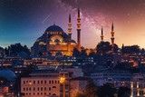 Fototapeta Tęcza - View to Eminonu pier and Suleymaniye mosque across Bay of Golden Horn on starry night