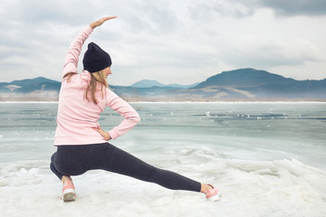 Running woman. Runner is jogging in winter day. Female fitness t