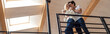 © LIGHTFIELD STUDIOS - Panoramic shot of young couple with coffee embracing at balcony
