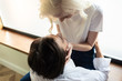 © LIGHTFIELD STUDIOS - Overhead view of young couple hugging beside window