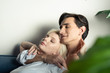 © LIGHTFIELD STUDIOS - Side view of smiling couple with closed eyes embracing at home