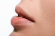 © LIGHTFIELD STUDIOS - close up of young woman with shiny lip gloss on lips