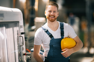 Wall Mural - Portrait of worker in factory.