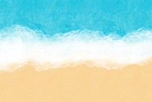 Turquoise Ocean Water With Sea Foam And Yellow Sand, Top View