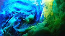 Abstract Dancing Colorful Fume Background. Clouds Of Smoke Blue, Green And Yellow, A Whirlwind Of Paints