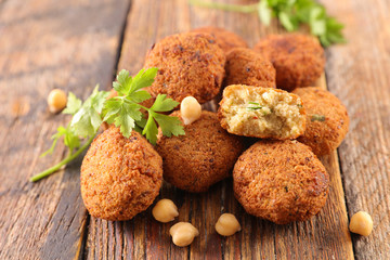 Poster - fried falafel with herb on wood background