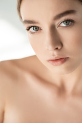 Wall Mural - beautiful naked girl looking at camera on white