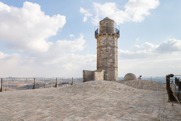 The minaret and the mosque roof of the Muslim part of the grave of the prophet Samuel on Mount of Joy near Jerusalem in Israel