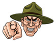 An army bootcamp drill sergeant soldier looking mean and pointing at the viewer