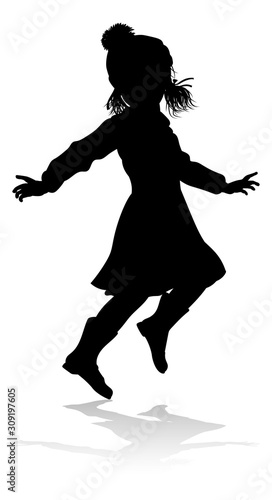 A child in silhouette playi...