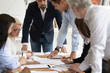 © fizkes - Multi-ethnic businesspeople brainstorming during office meeting at boardroom