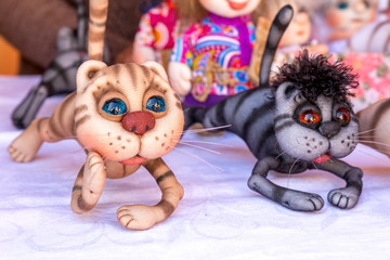 Wall Mural - Russia, Samara, August 2019: Sale of soft souvenir toys at the exhibition of masters. Funny kittens.