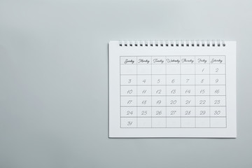 Sticker - Paper calendar on light grey background, top view. Space for text