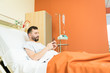 © AntonioDiaz - Man Using Mobile Phone In Hospital